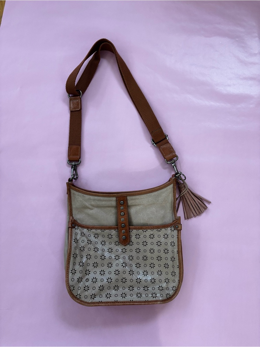 The Sak Beige and Brown Laser-Cut Crossbody Bag with Tassel